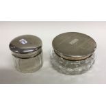 A heavy silver top powder jar together with one ot