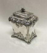 A good George III chased silver tea caddy of Rococ