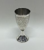 A large engraved silver Kiddush cup decorated with