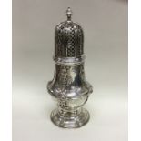 A massive fine quality silver caster engraved with