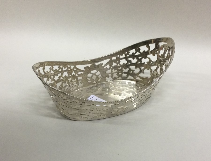 A heavy Continental silver pierced basket with bea