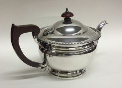 An Edwardian silver teapot. Birmingham 1936. By As