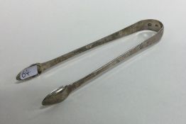 DUBLIN: A good pair of Georgian silver sugar tongs