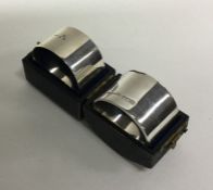 Two heavy silver napkin rings of plain form. Appro