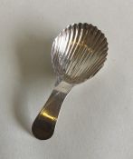 An Antique bright cut silver caddy spoon. Punched