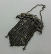 A heavy Antique silver purse with hinged decoratio