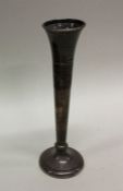 An Edwardian silver spill vase with beaded edge. B