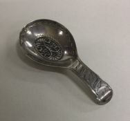 A Georgian silver boat shaped caddy spoon with fil