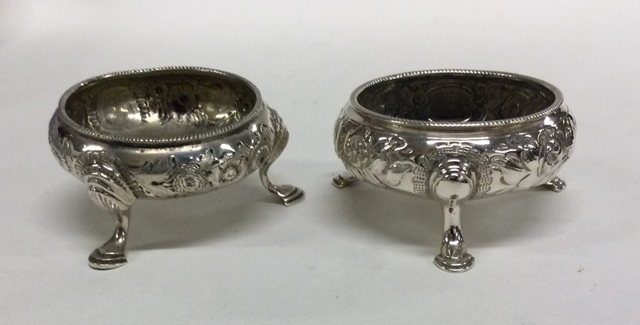 A good pair of Georgian silver salts chased with f