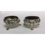 A good pair of Georgian silver salts chased with f