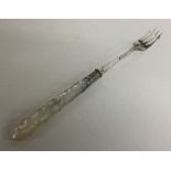 A silver and MOP pickle fork with twisted stem. Sh