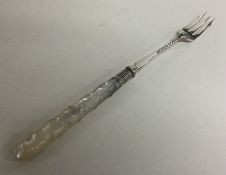 A silver and MOP pickle fork with twisted stem. Sh