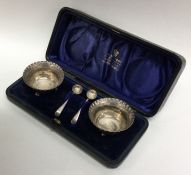 A cased pair of silver salts with crimped rims. Lo