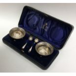 A cased pair of silver salts with crimped rims. Lo