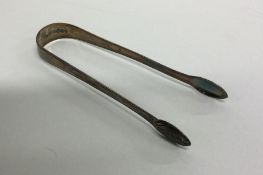 A good pair of Georgian silver sugar tongs. London