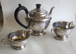 A heavy silver three piece tea service. Birmingham