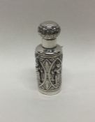 An Indian silver scent bottle decorated with figur