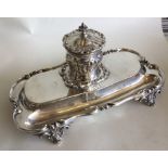 A good quality silver inkstand decorated with scro