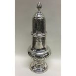 A large Continental silver sugar caster of half fl