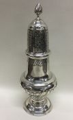 A large Continental silver sugar caster of half fl