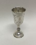 A stylish silver goblet with engraved decoration.