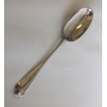 A George II silver bottom marked spoon with shell