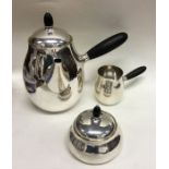 GEORG JENSEN: A rare silver three piece tea servic