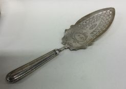 A George III silver fish slice with pierced blade.