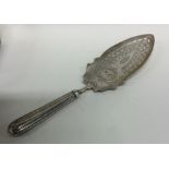 A George III silver fish slice with pierced blade.