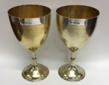 A good pair of Victorian parcel gilt goblets with