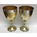 A good pair of Victorian parcel gilt goblets with