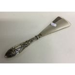 A good Chinese silver shoe horn mounted with a dra