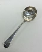 A Georgian OE pattern silver ladle with crested ar