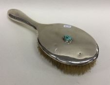 LIBERTY & CO: A silver mounted hairbrush of typica