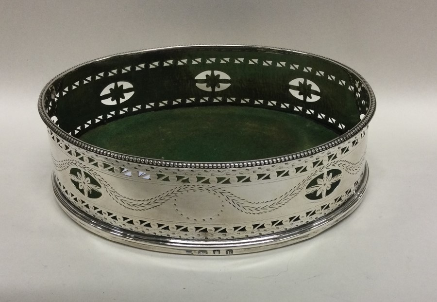 A large oval Georgian pierced silver coaster decora - Image 2 of 2