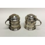 An attractive pair of Edwardian silver dome top mu