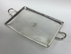 An attractive Georgian silver bacon tray with cres