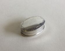 An oval silver pill box with hinged lid. Approx. 1