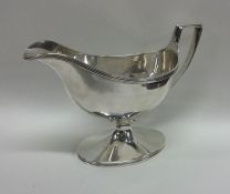 A good Georgian silver sauce boat on sweeping pede