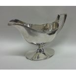 A good Georgian silver sauce boat on sweeping pede