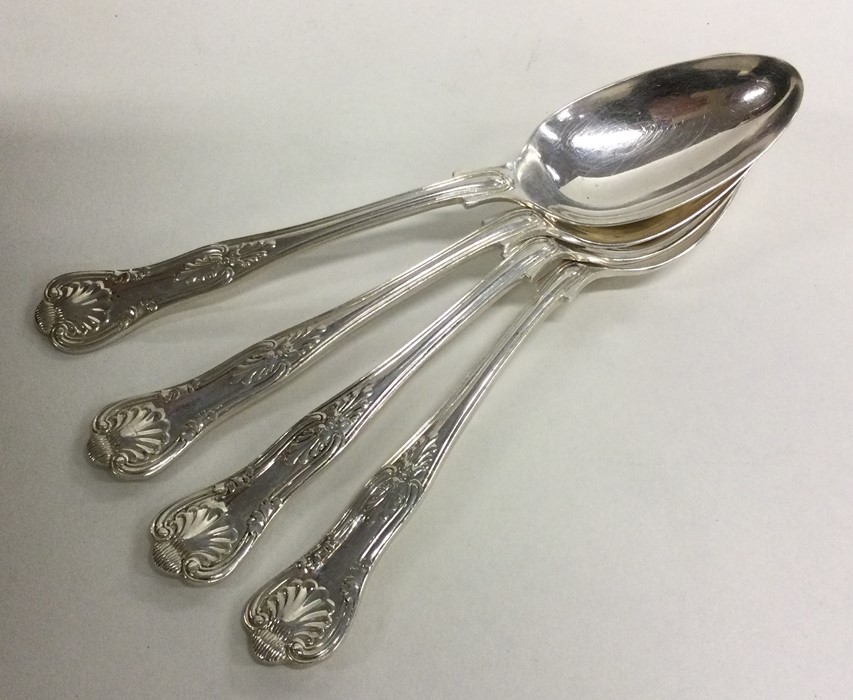 A set of four Kings' pattern silver dessert spoons