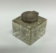 A silver and glass mounted inkstand of cubed form.