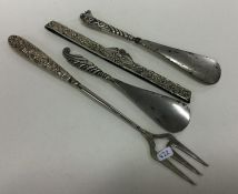 A group of silver mounted shoe horns etc. Approx.