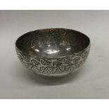 An Antique Burmese silver bowl with scroll decorat