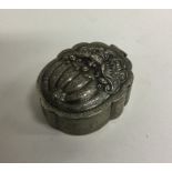 A Chinese silver box of shaped form to hinged lid