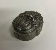 A Chinese silver box of shaped form to hinged lid