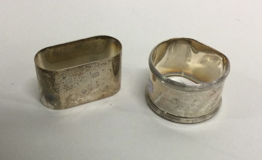 Two heavy silver napkin rings. Various dates and m
