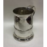 A large Georgian silver tapering quart mug on swee