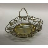 A fine quality silver gilt swing handled basket de