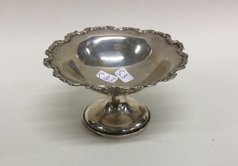 An Edwardian silver bonbon dish of shaped form. Bi